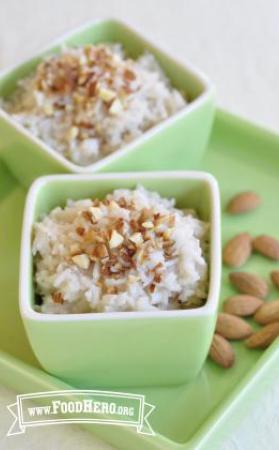 Portion of Almond Rice Pudding recipe topped with chopped almonds 
