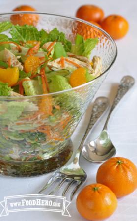 Large bowl of mandarin orange and chicken salad. 