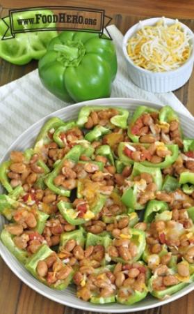 Bell pepper pieces are topped with beans, salsa and cheese for a variation on classic nachos.