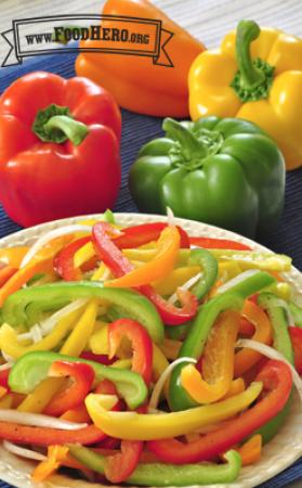 Red, yellow and green bell pepper strips are mixed with onion slices and dressing for a light and crunchy salad.