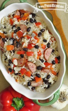 Large dish of a simple rice, sausage and vegetable mix.
