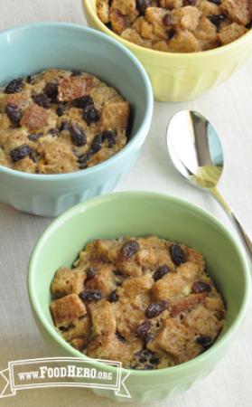 Dishes of whole-grain bread pudding with raisins.