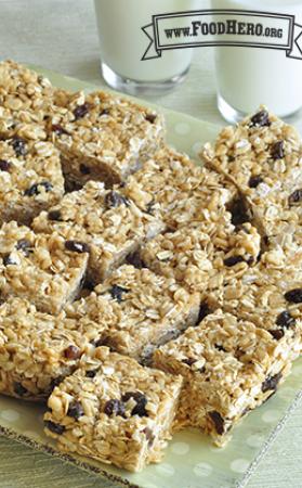Platter of oat and peanut butter squares with raisins.