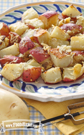 Plate of red potatoes with grated parmesan cheese.