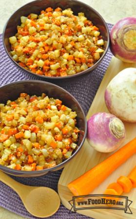 Bowls of cubed turnips and carrots with sauce.