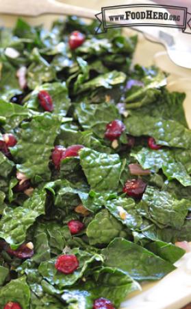 Plate of stir-fried kale with cranberries.