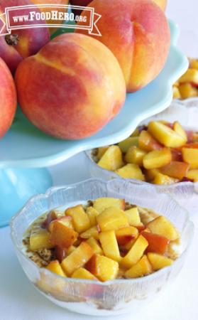 Small bowls of yogurt with a soft peach topping.