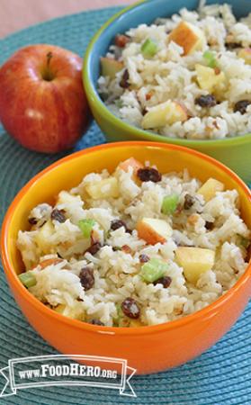 Bowls of rice with celery, apples and raisins.