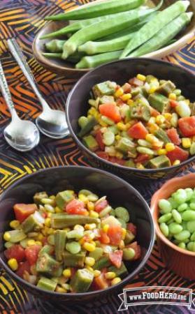 Bowls filled with a variety of vegetables and okra. 