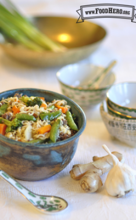 Bowl of ramen noodles and vegetables shown with a renge spoon.