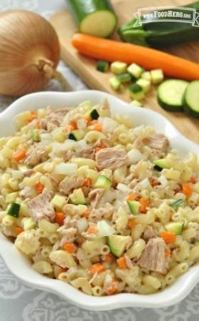 Bowl of macaroni noodles with tuna and vegetable cubes.