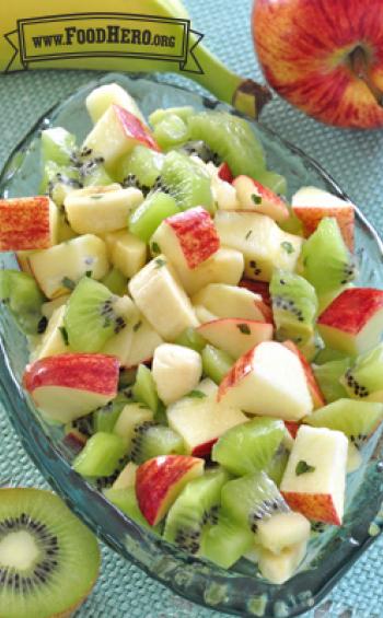 Colorful mix of chopped fruit with dressing.