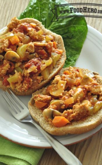 Open faced buns with a saucy meat and vegetable mix.