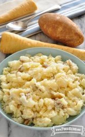 Bowl of seasoned and mashed parsnip and potato.