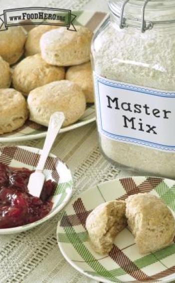 Plate of golden biscuits served with jam.