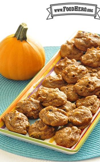 Large platter of orange pumpkin cookies. 