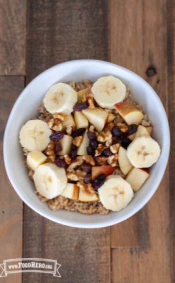 Rice and fruit topped with chopped nuts.