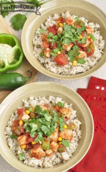 Bowls of rice with chicken and vegetables topped with cilantro.