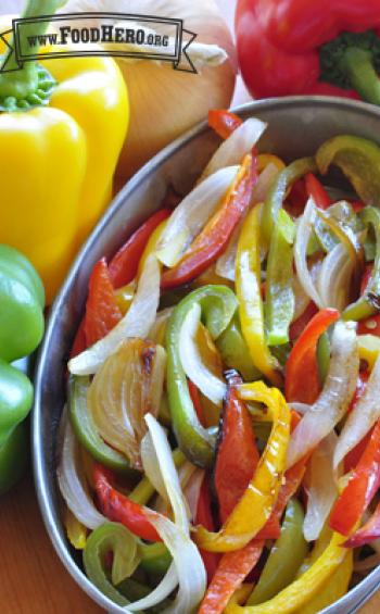 Bowl of tender bell pepper and onion slices.