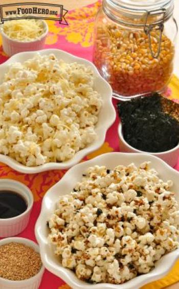 Bowls of popcorn served with seaweed and seasonings.