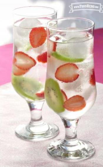 Glasses of water with strawberry and kiwi slices.
