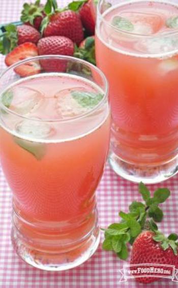 Glasses of pink strawberry water with mint.