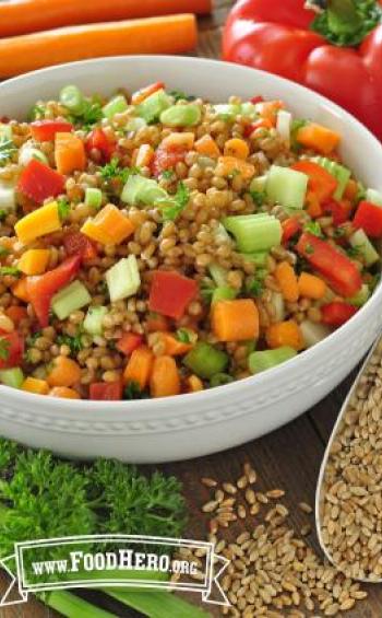 Bowl of wheat berries with a colorful vegetable mix.