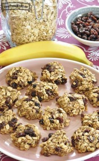 Chewy oat and raisin cookies are shown on a serving plate.