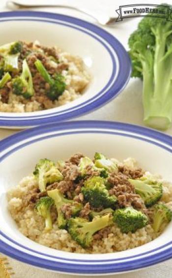 Shallow bowls of rice are topped with a flavorful mix of ground beef and broccoli.