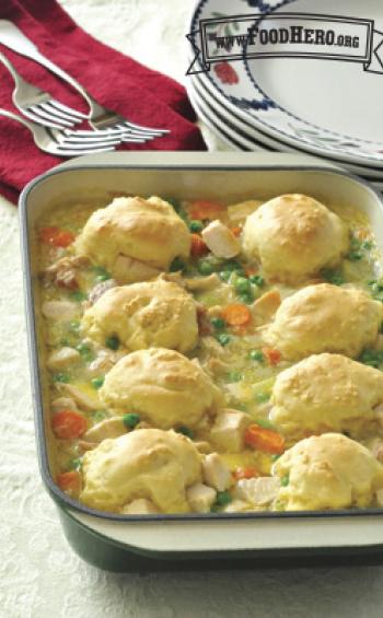 Baking dish of dumplings with a saucy chicken and vegetable base.
