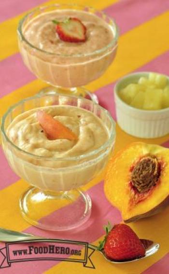 Footed glasses filled with a creamy fruit dessert.