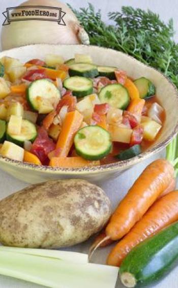 Bowl of soup with a medley of vegetables.