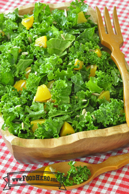 Wooden bowl holding a large Kale Salad.