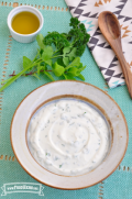 Small bowl of a creamy, white sauce.